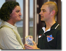 Photo of the client paying money to the builder.