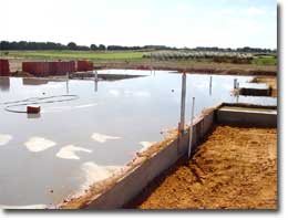Photo of a concrete slab soaked in water. 
