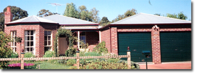 Photo of a house with metal roof sheeting.