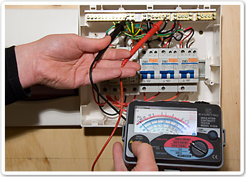 Photo showing insulation tester probes connected to switch board