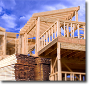 Photo of a house under construction - the frame is partly up.