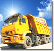 Photograph of a tip truck containing a load of timber.