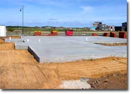 Photo of a concrete slab on the ground. 