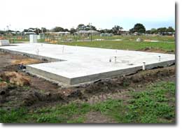 Photo of a concrete slab on the ground. 