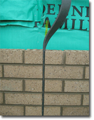 Photo showing an articulation joint in brickwork - a gap between the bricks that is filled with a strip of filler.