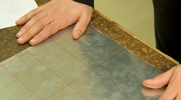 Photo showing a piece of material marked out