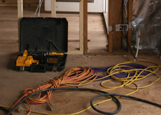 Image of cables on floor creating a hazard