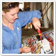 Photo showing a worker using a screwdriver