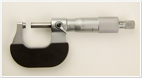 Photo of a precision measuring tool that has a rotating spindle and scale